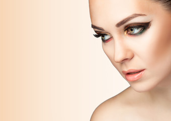 Fototapeta premium Young woman with makeup closeup
