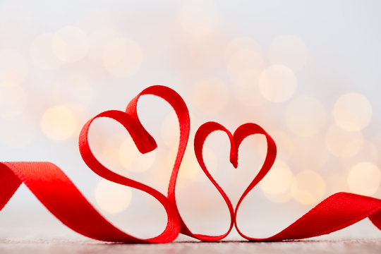Red heart with ribbon. Valentines day background.