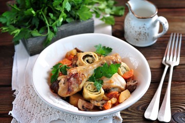 Chicken stew with vegetables, potatoes, carrots, mushrooms, onions and rolls with dill and green onions.