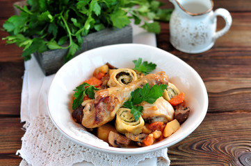 Chicken stew with vegetables, potatoes, carrots, mushrooms, onions and rolls with dill and green onions.