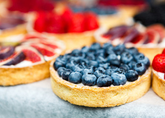 Closeup of blueberry tart dessert tray assorted