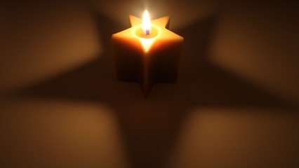  Candle and its shadow in the shape of a star.