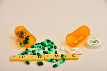 Pills, capsules, containers and signs to symbolize prescription medication abuse.