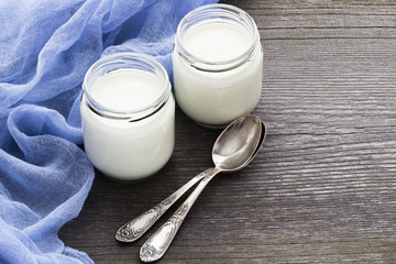 Fresh homemade yogurt  on a old grey wooden table