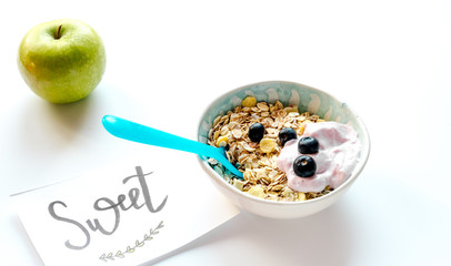 concept kid breakfast with muesli on white background