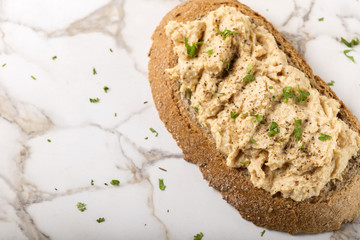 Bread slice with cream made from mashed chicken breast with herb