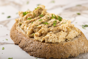 Bread slice with cream made from mashed chicken breast with herb