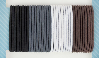 Muted set of hair bands on card.
