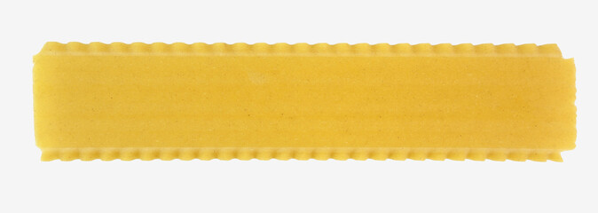 Raw lasagna sheet with rippled edges. Isolated.