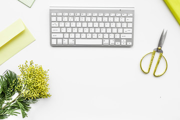 female desktop with keyboard and flowers top view mock up