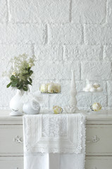 white room objects and hand made towels and drawer