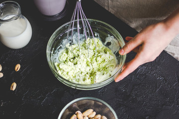 organic ice cream homemade process on dark background with hands