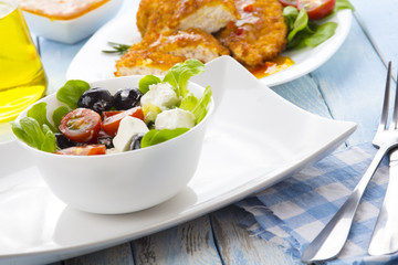 Greek salad kitchen blue wooden background
