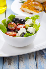 Greek salad kitchen blue wooden background
