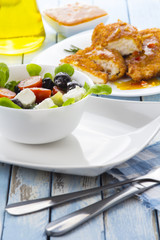 Greek salad kitchen blue wooden background
