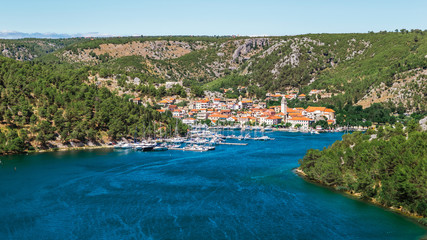 Town of Skradin on Krka river in Dalmatia, Croatia viewed from distance. Skradin is a small historic town and harbour