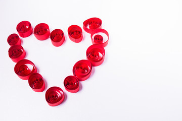 Quilling art. Paper heart on the white background