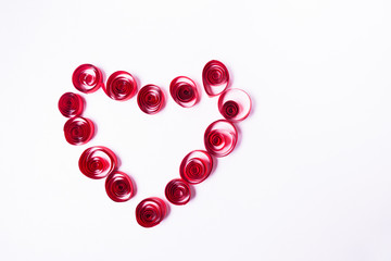 Quilling art. Paper heart on the white background