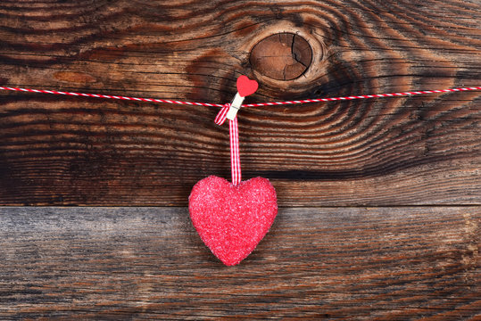 Red heart on a beautiful old wooden background as love concept for valentines day