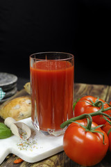 Raw Organic red Tomato Juice with salt, basil and bread