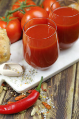 Raw Organic red Tomato Juice with salt, basil and bread