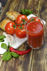 Raw Organic red Tomato Juice with salt, basil and bread