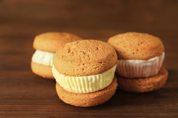 Ice cream cookie sandwiches on wooden background