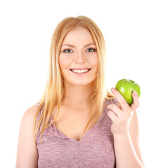 Young woman holding apple on white background