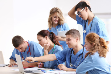 Group of medical students having lecture indoors