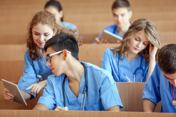 Smart medical students at lecture indoors
