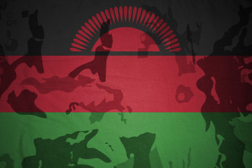 flag of malawi on the khaki texture . military concept