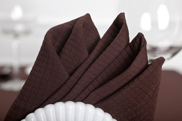 Place setting with brown napkin
