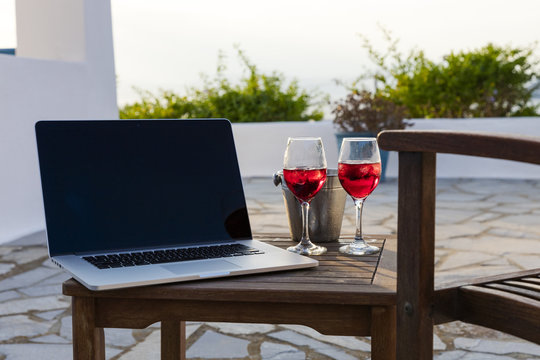 Laptop and wine glasses