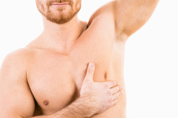 Muscular male torso with focus on armpit - obrazy, fototapety, plakaty