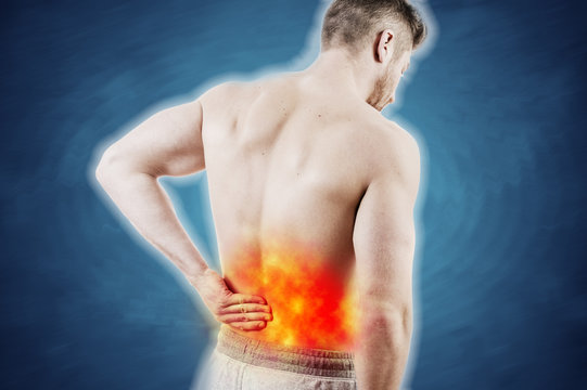 Concept picture of a man with lower back pain