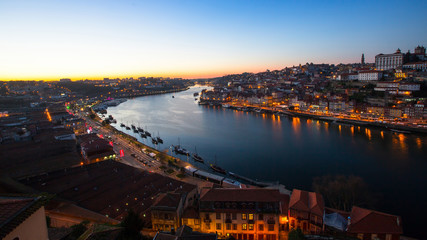 Fototapeta premium View over the Douro river by night, Porto, Portugal.