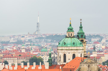 Fototapeta premium Prague Church of St. Nicholas, the TV tower Zizkov