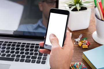 Person Hand Using Mobile Phone