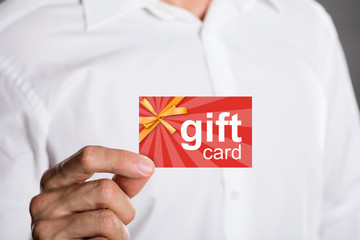 Man Holding Gift Card