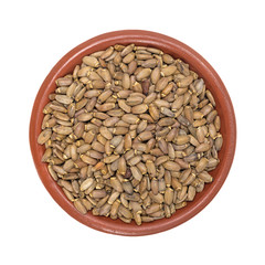 Organic milk thistle seeds in a small bowl top view isolated on a white background.