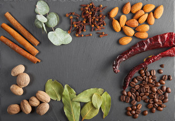 nuts, spices and food on a wooden tray