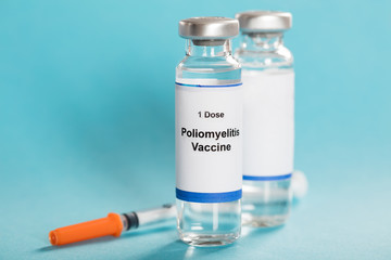 Poliomyelitis Vaccine Bottles With Syringe