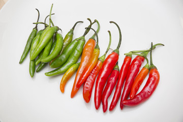 Fresh chili peppers on white background