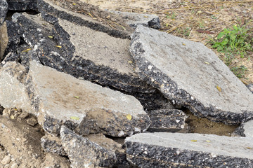 Old cracked asphalt road scrap heap damage