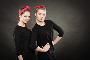 Two funny positive retro styled female portrait.