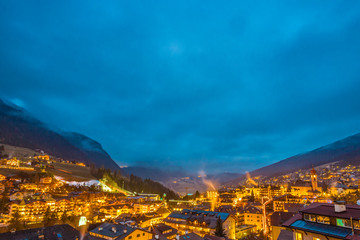 night view of mountain village in alpine valley