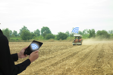 iot, internet of things, industrial agriculture concept, smart farming. Farmer use wireless...