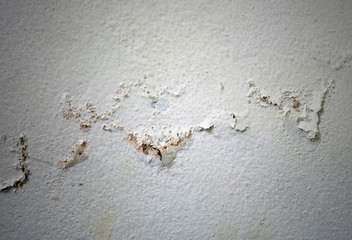 racked paint on rough old wall