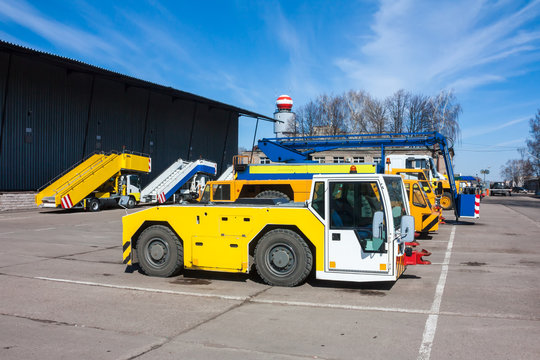 Tow tractors, passenger boarding steps vehicles and other airport machinery