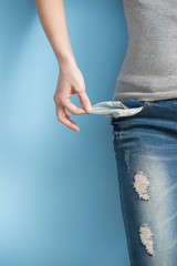 woman showing her empty pockets